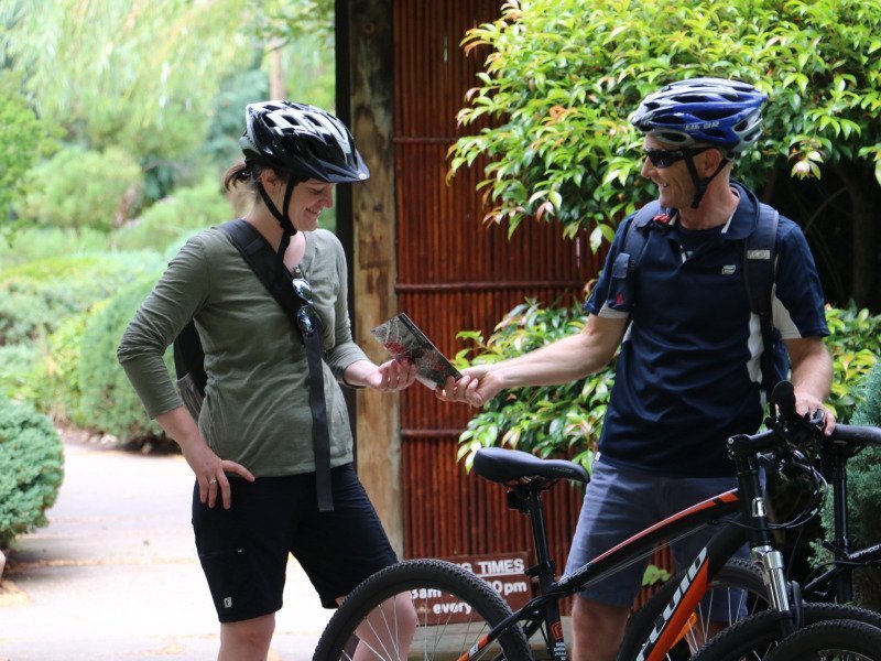 riders reviewing bike tour map