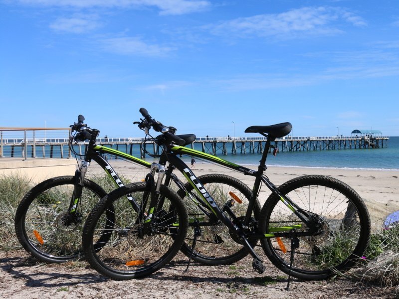 two mountain bikes parked on beach near adelaide